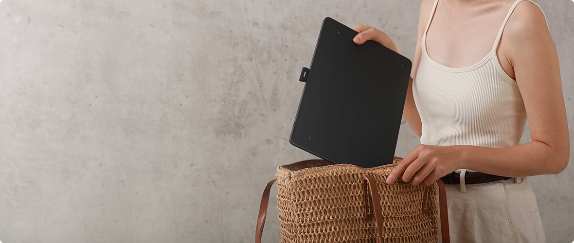 Huion Inspiroy Frego tablet being placed in a bag
